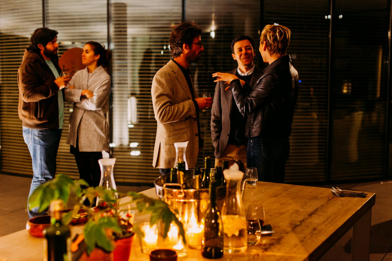 Small group of professionals networking and talking at a business event
